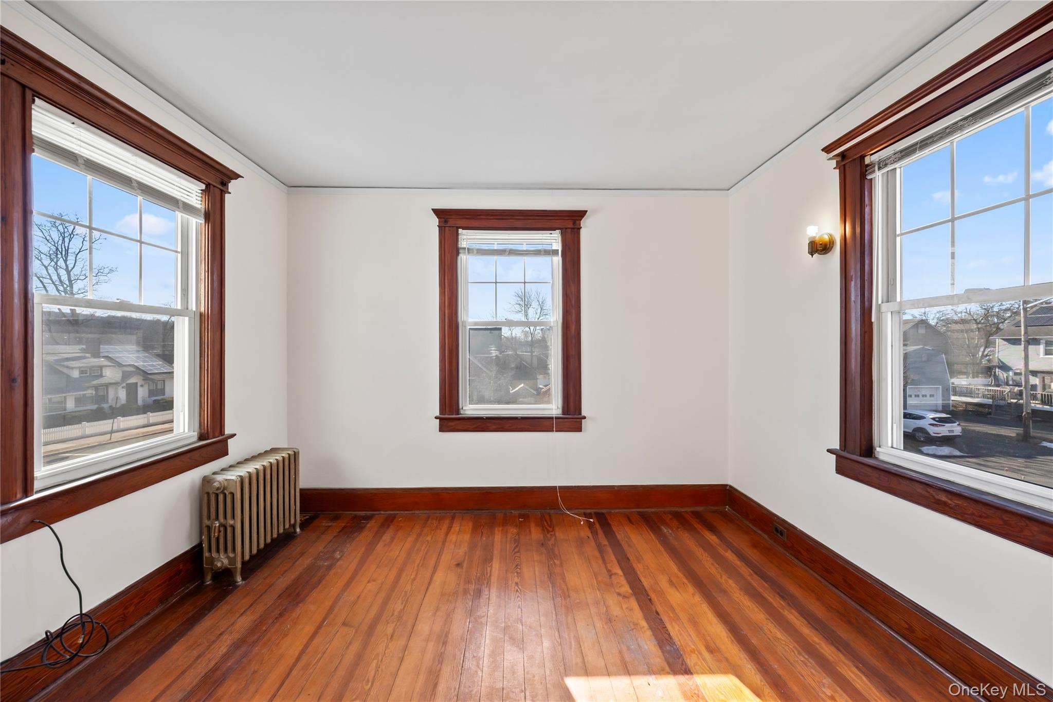 47 Prairie Avenue Suffern, NY 10901 - Photo 23 of 45 a view of an empty room with wooden floor and a window