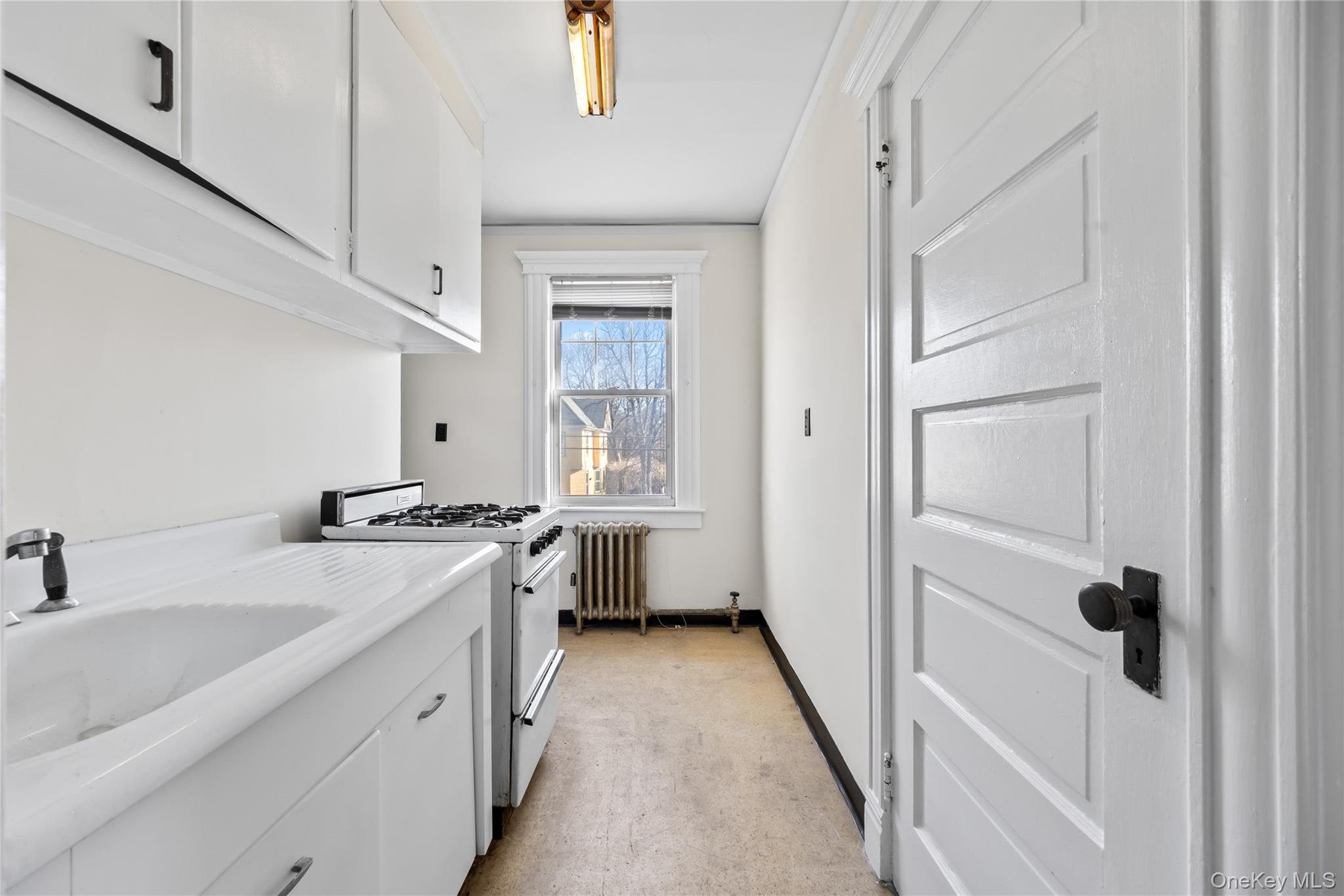 47 Prairie Avenue Suffern, NY 10901 - Photo 26 of 45 a kitchen with a sink stove and refrigerator