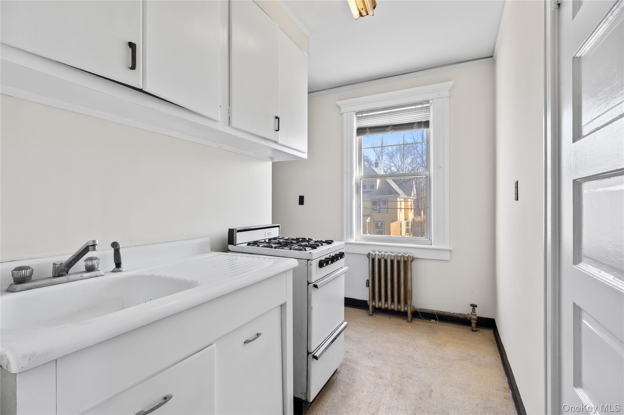 47 Prairie Avenue Suffern, NY 10901 - Photo 27 of 45 a kitchen with stainless steel appliances granite countertop a stove and a sink