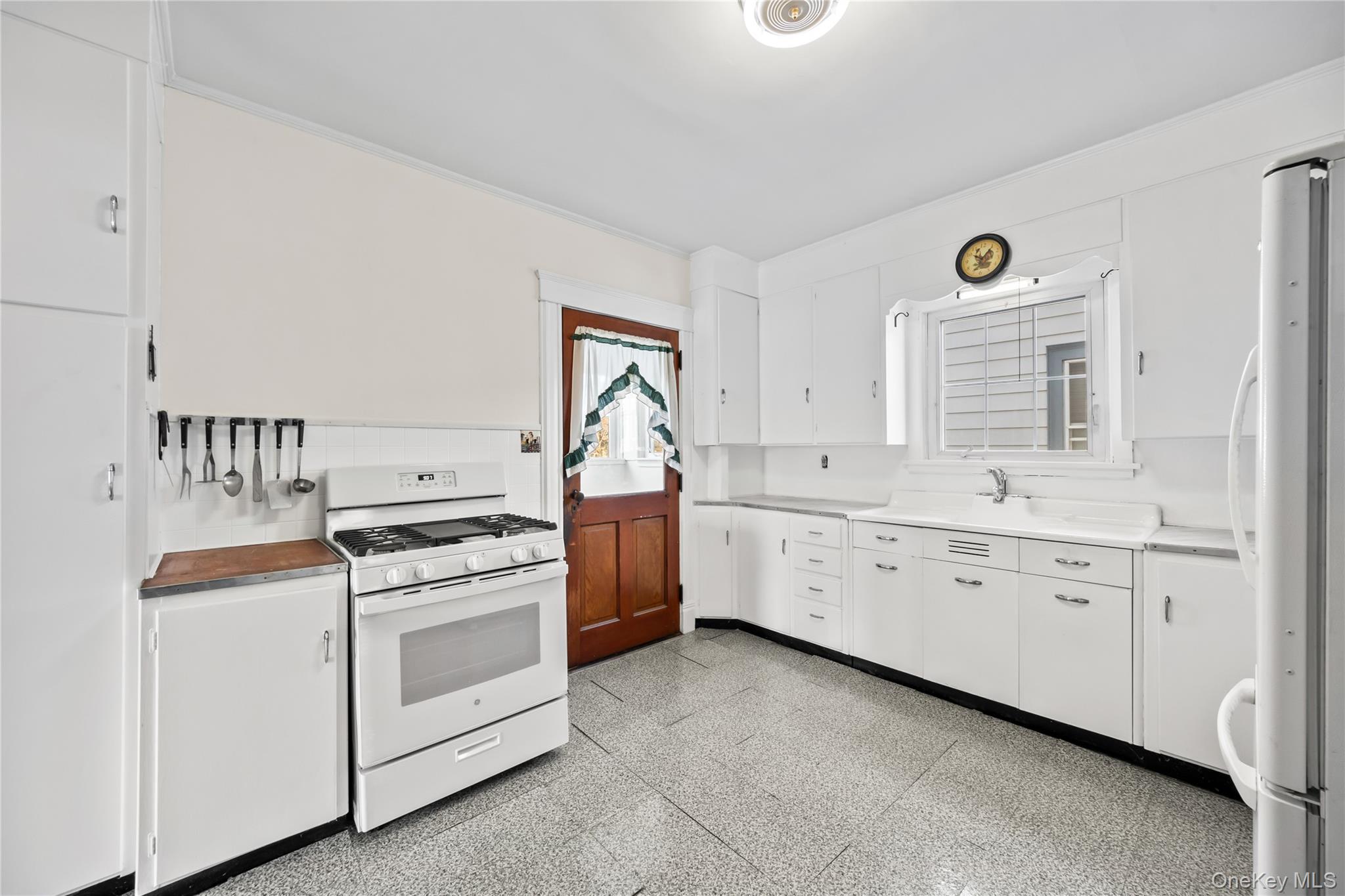 47 Prairie Avenue Suffern, NY 10901 - Photo 9 of 45 a kitchen with cabinets appliances a sink and a window