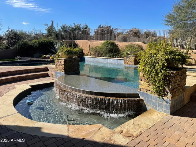 a view of a swimming pool with a patio