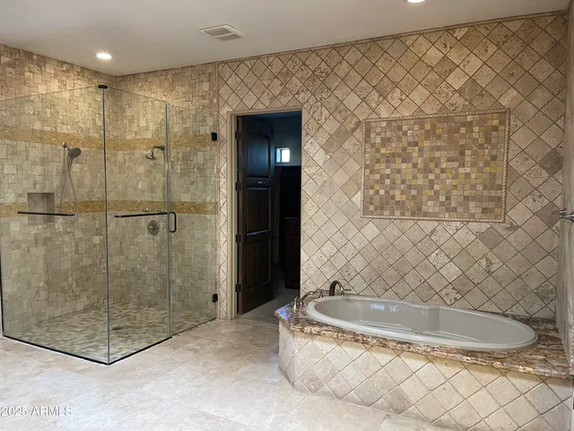 a bathroom with a bath tub