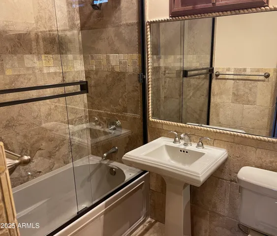 a bathroom with a sink and mirror