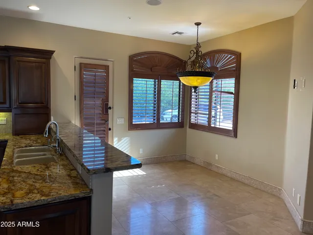 a workspace with furniture and window