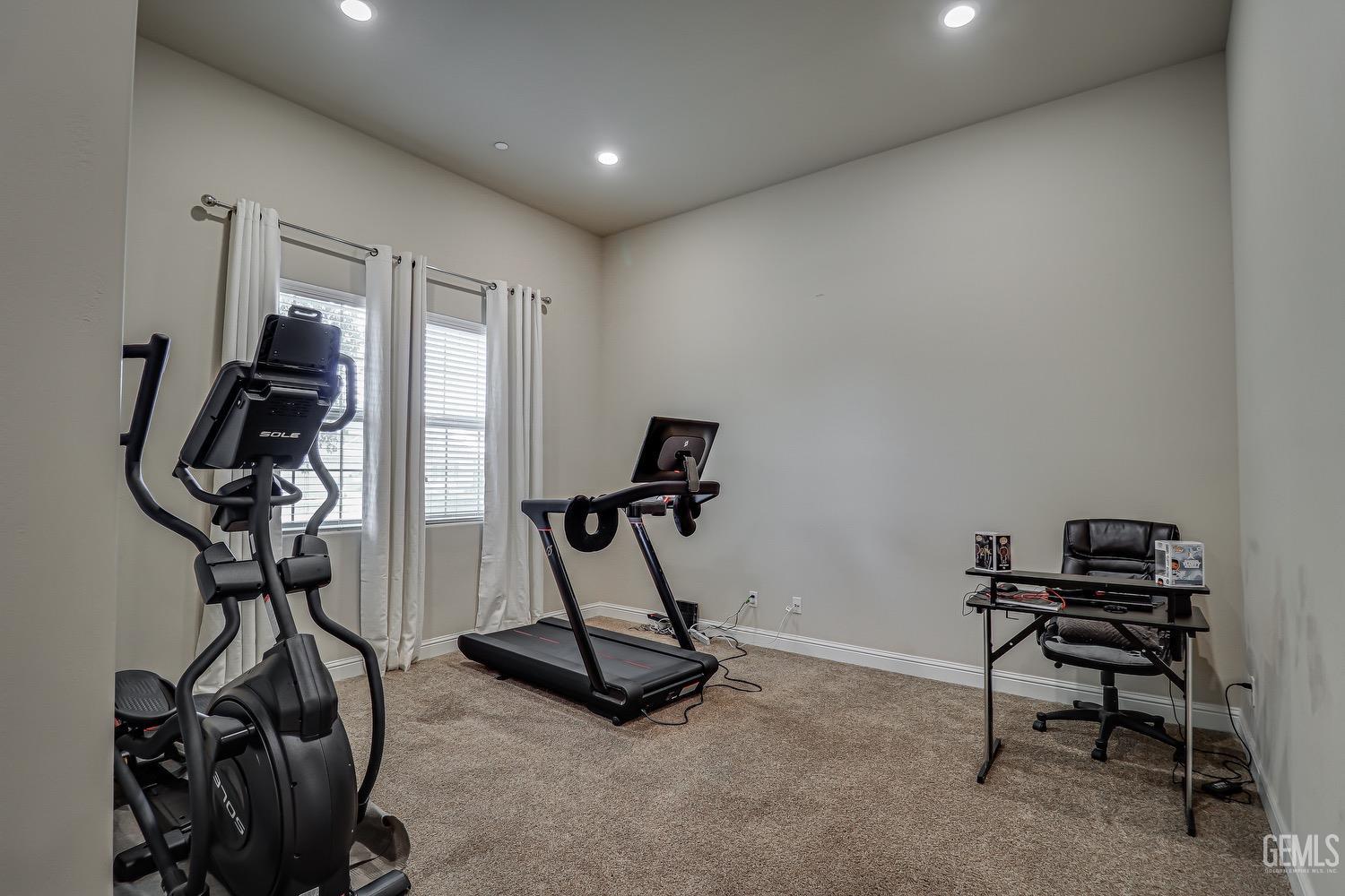 Undisclosed Address Bakersfield, CA 93311 - Photo 12 of 63 a view of a room with gym equipment