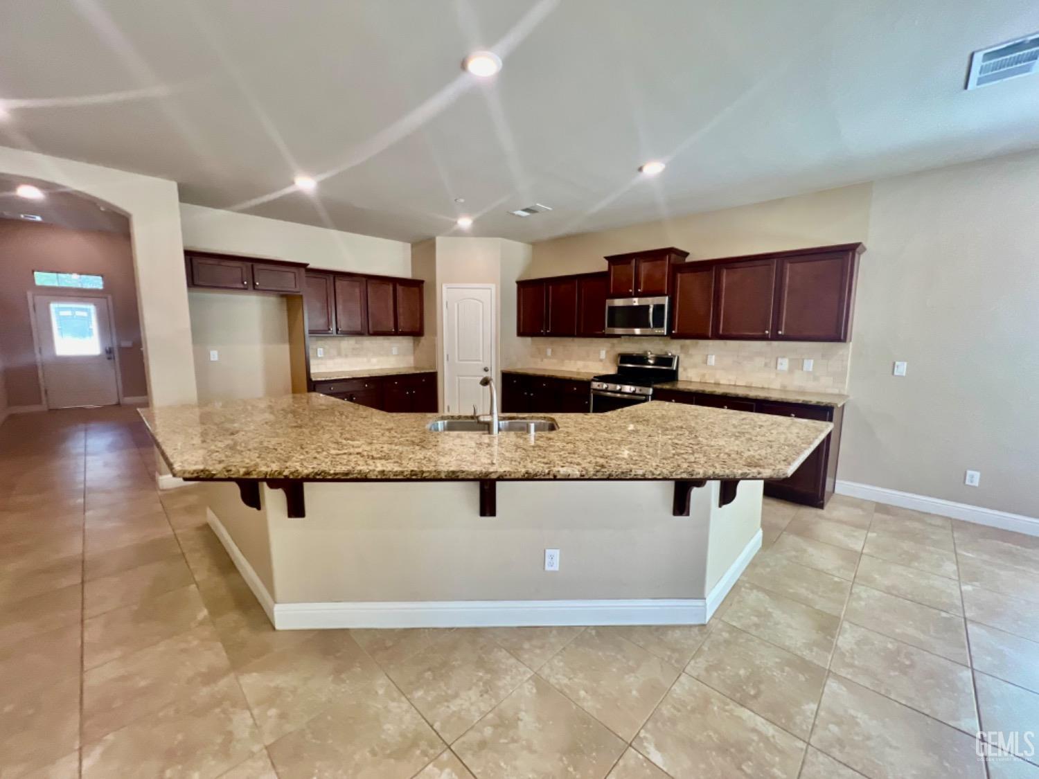 Undisclosed Address Bakersfield, CA 93311 - Photo 13 of 63 a view of kitchen with stainless steel appliances granite countertop a sink and a stove