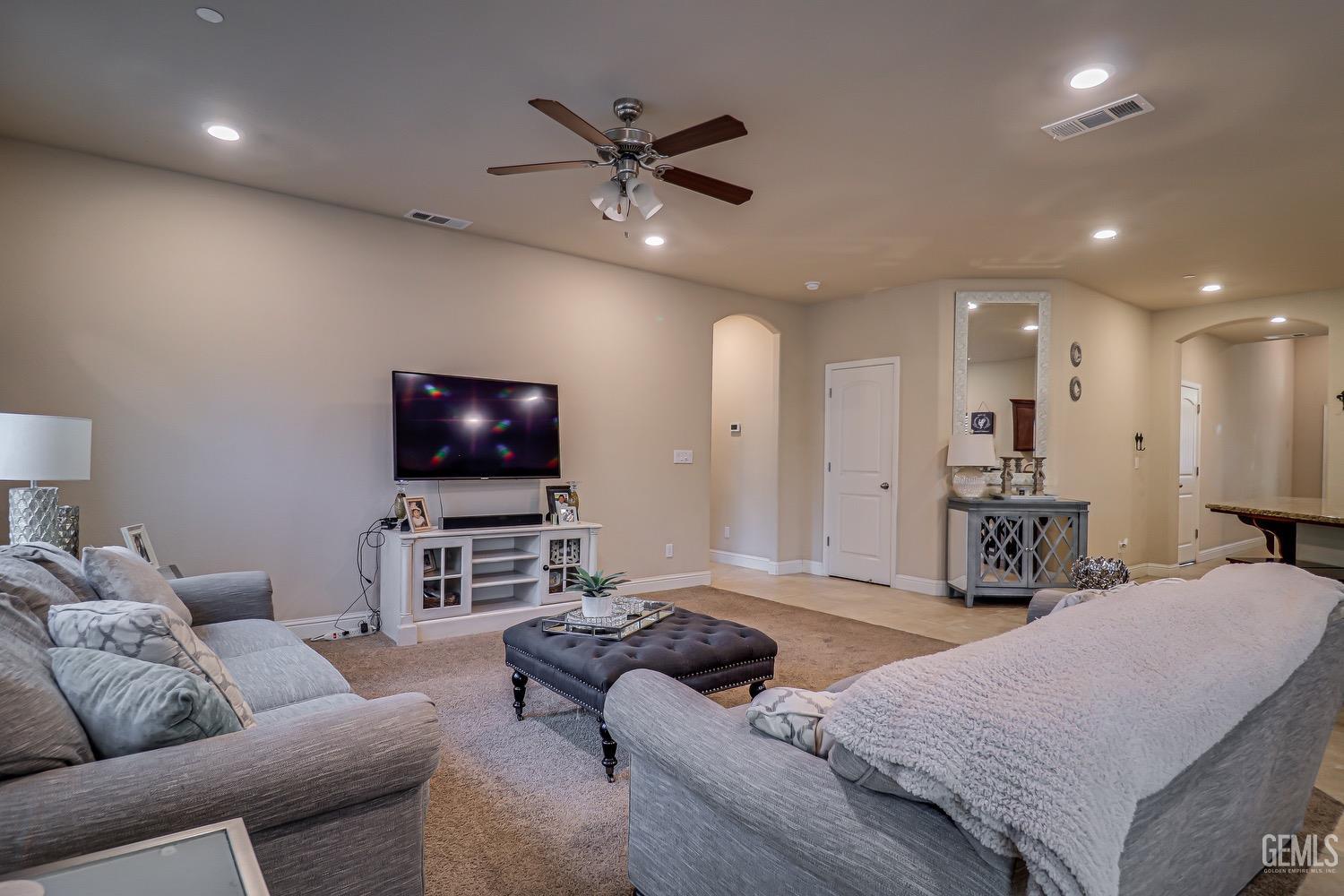 Undisclosed Address Bakersfield, CA 93311 - Photo 19 of 63 a living room with furniture and a flat screen tv