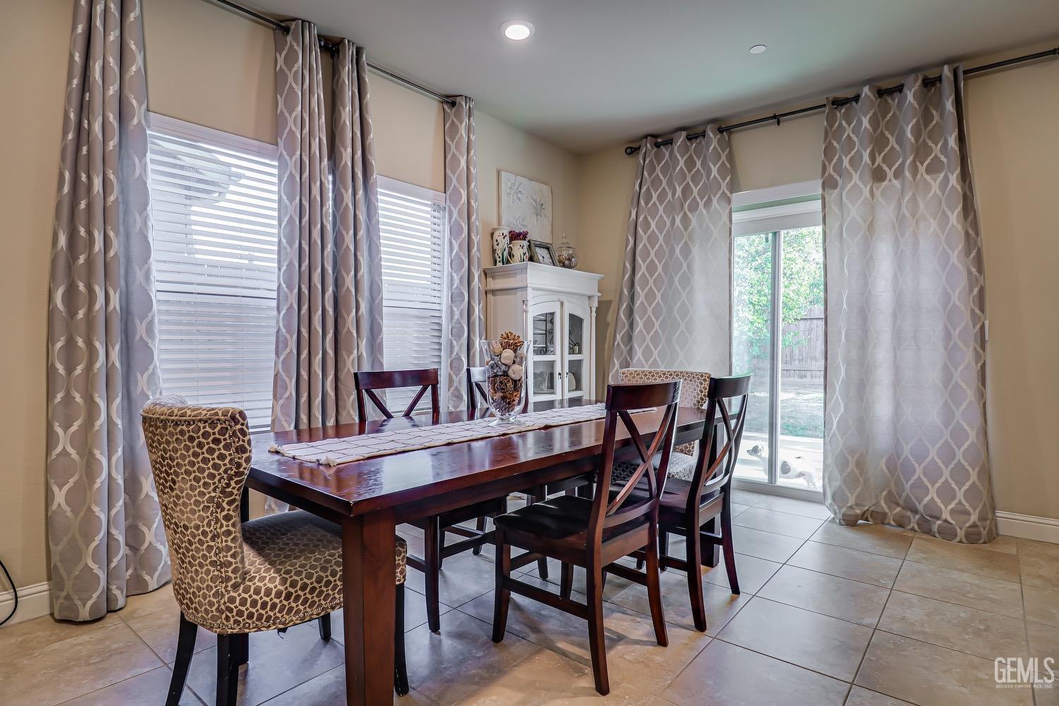 Undisclosed Address Bakersfield, CA 93311 - Photo 21 of 63 a view of a dining room with furniture and window