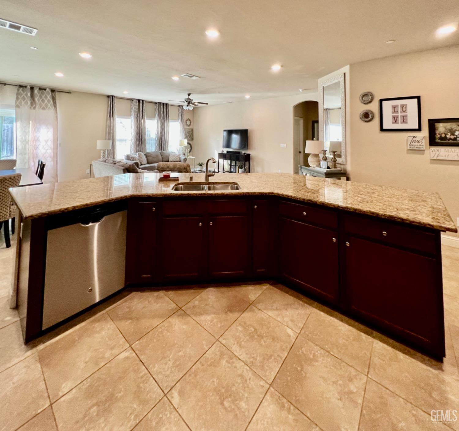 Undisclosed Address Bakersfield, CA 93311 - Photo 30 of 63 a kitchen with stainless steel appliances granite countertop a refrigerator and a sink