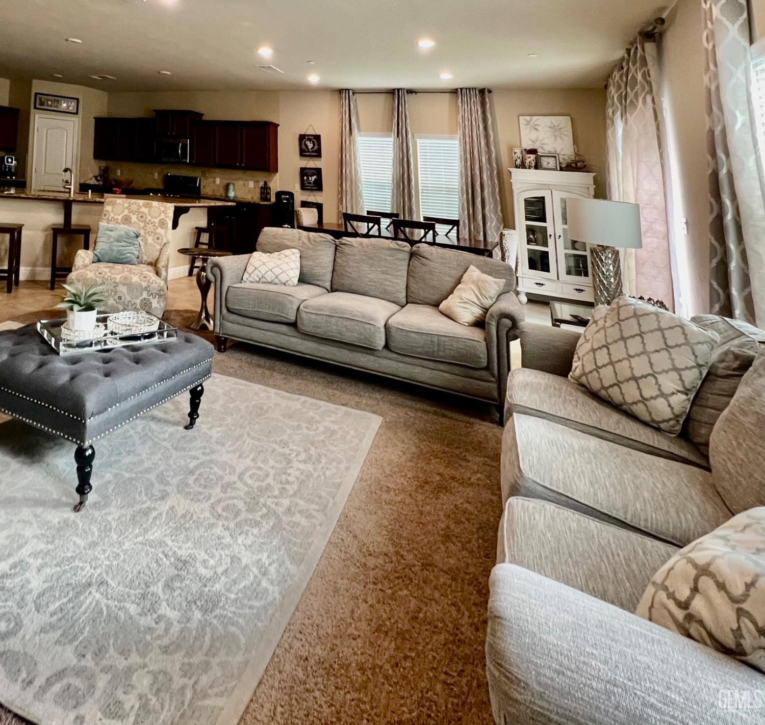 Undisclosed Address Bakersfield, CA 93311 - Photo 34 of 63 a living room with furniture kitchen view and a couch