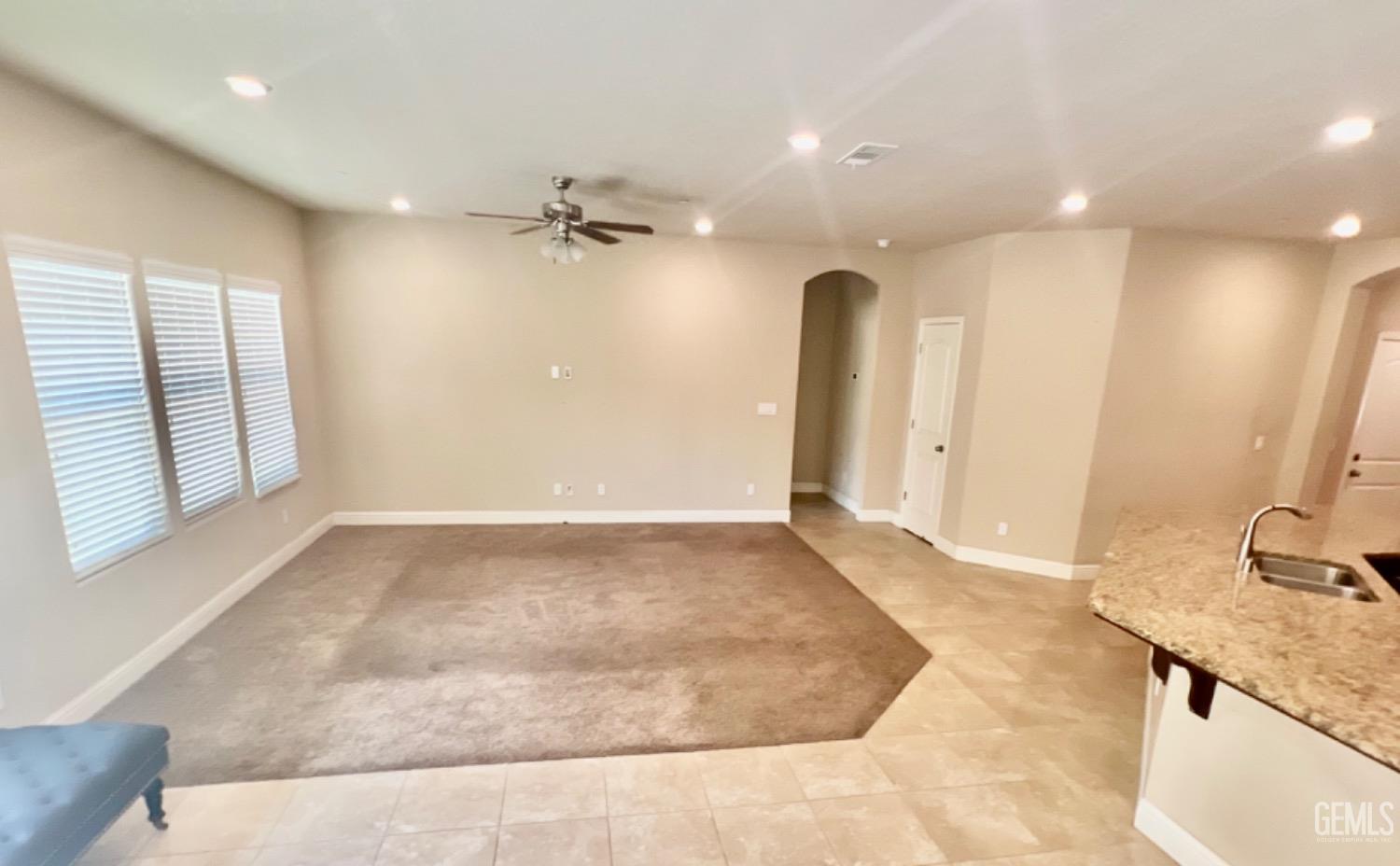 Undisclosed Address Bakersfield, CA 93311 - Photo 36 of 63 a view of a kitchen cabinets a sink and a wooden floor