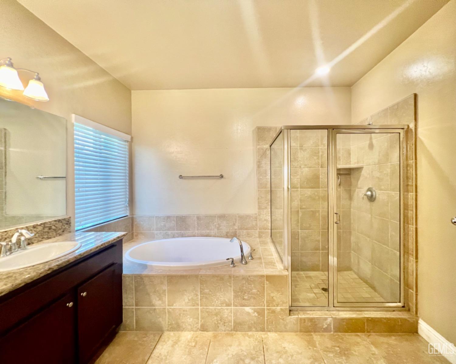 Undisclosed Address Bakersfield, CA 93311 - Photo 44 of 63 a bathroom with a shower and a sink