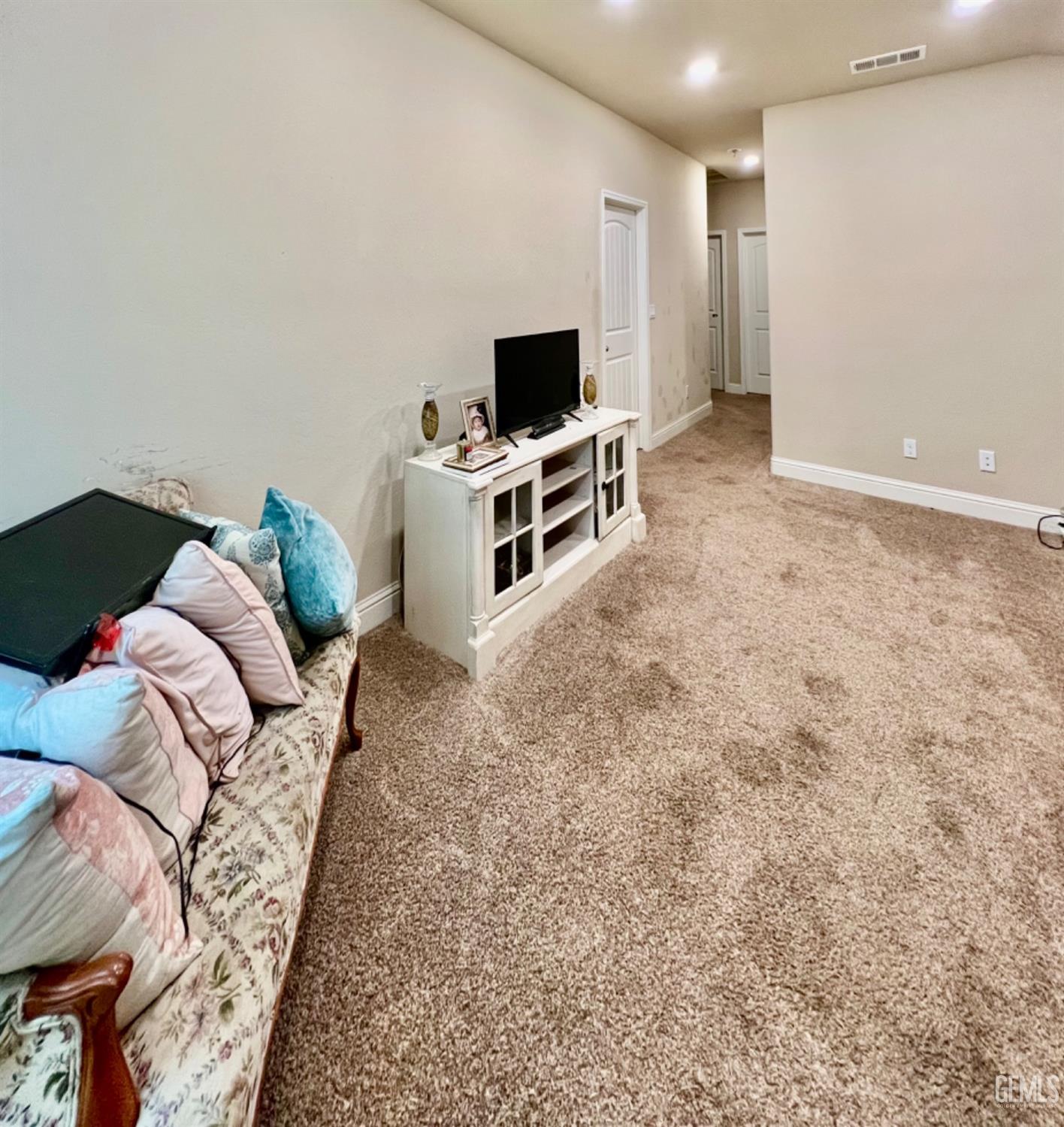 Undisclosed Address Bakersfield, CA 93311 - Photo 50 of 63 a living room with furniture and a flat screen tv