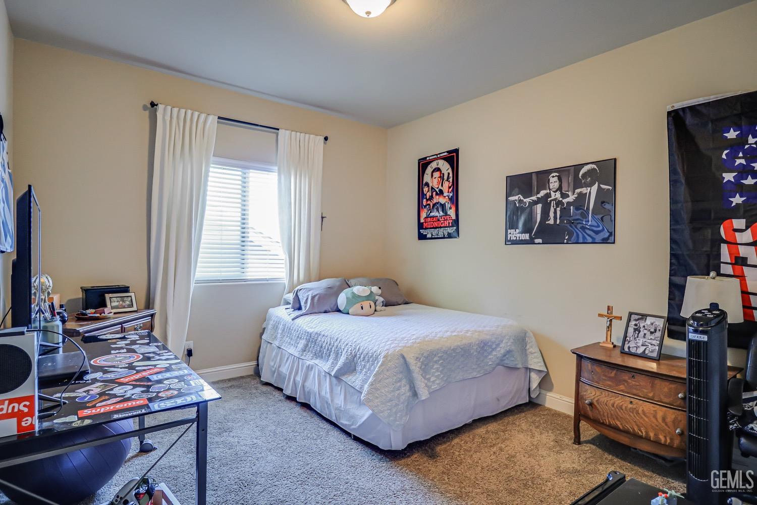 Undisclosed Address Bakersfield, CA 93311 - Photo 53 of 63 a bedroom with a bed and a window