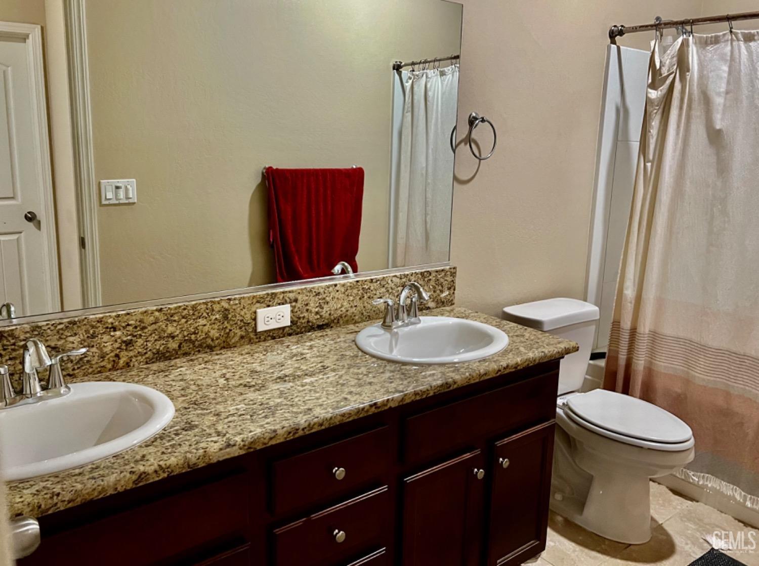 Undisclosed Address Bakersfield, CA 93311 - Photo 55 of 63 a bathroom with a granite countertop sink and a mirror