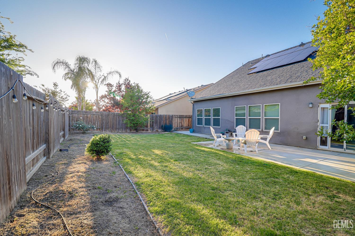 Undisclosed Address Bakersfield, CA 93311 - Photo 62 of 63 a view of a house with backyard sitting area and garden