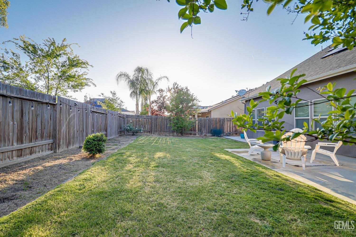 Undisclosed Address Bakersfield, CA 93311 - Photo 63 of 63 a backyard of a house with table and chairs
