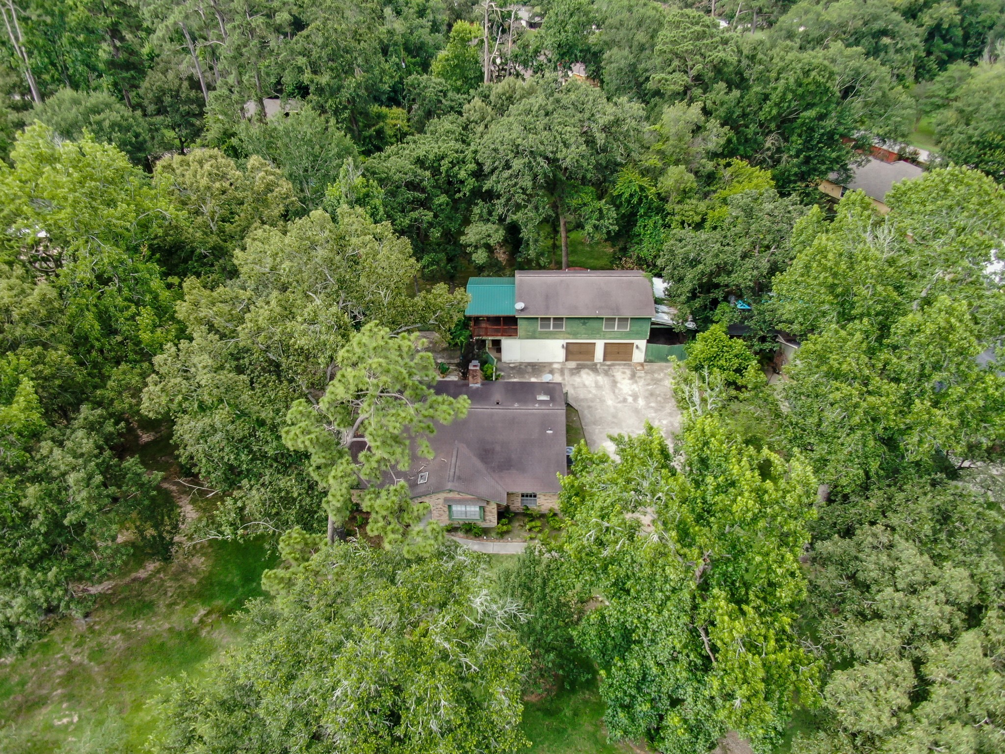 2207 Arendale Lane Spring, TX 77386 - Photo 26 of 30 Drone view of the front of the home and detached garage featuring garage apartment above.