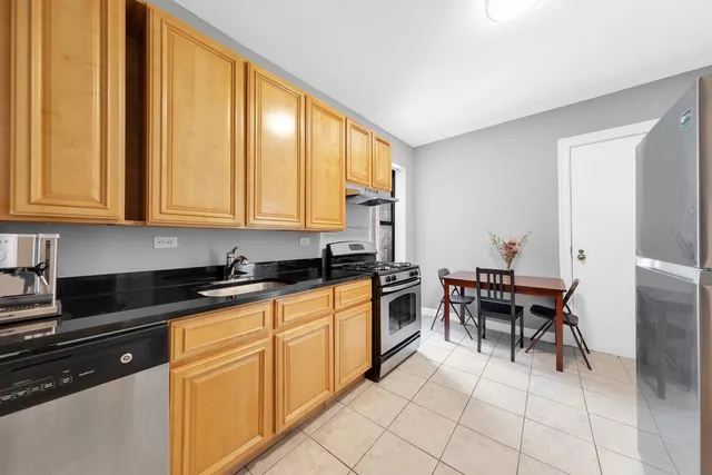 a bathroom with a sink a mirror and a toilet