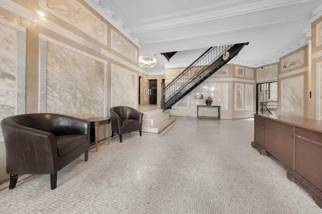 a kitchen with stainless steel appliances granite countertop a stove a refrigerator and a sink