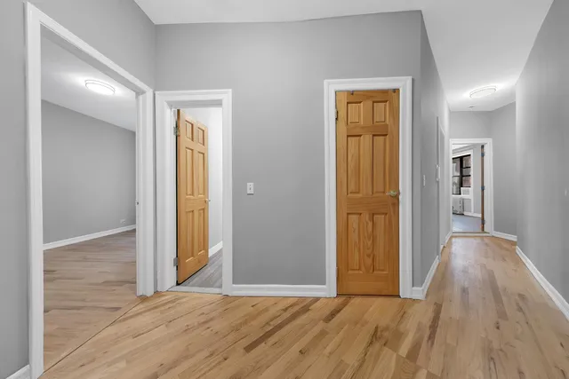 a kitchen that has a sink a stove and a wooden floor