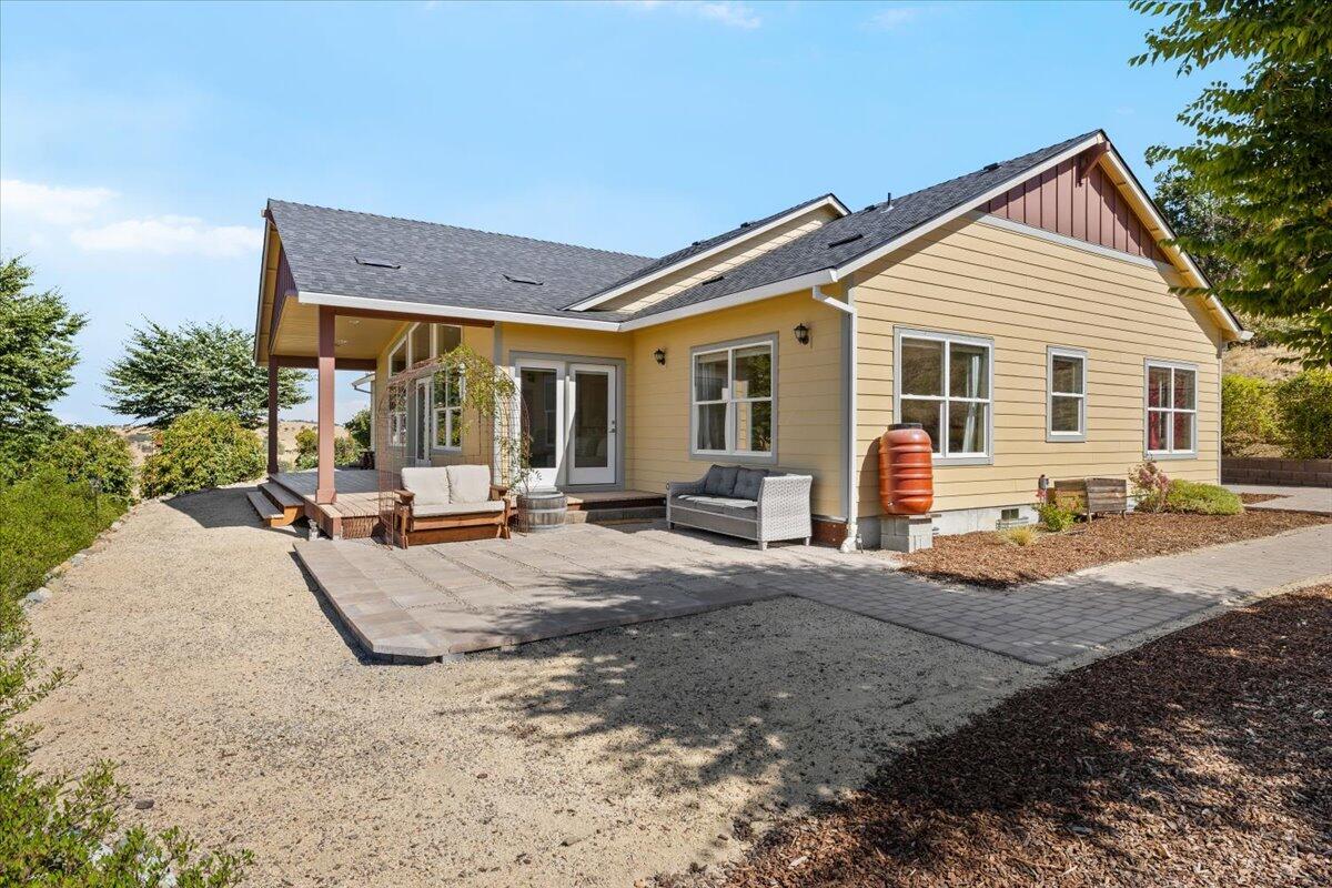 4856 Payne Road Medford, OR 97504 - Photo 6 of 49 South side of house, with patio and covered porch