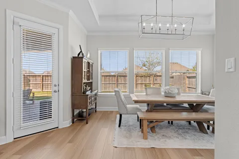 a view of a livingroom with furniture window and wooden floor