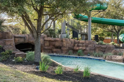 a view of a swimming pool with an outdoor seating