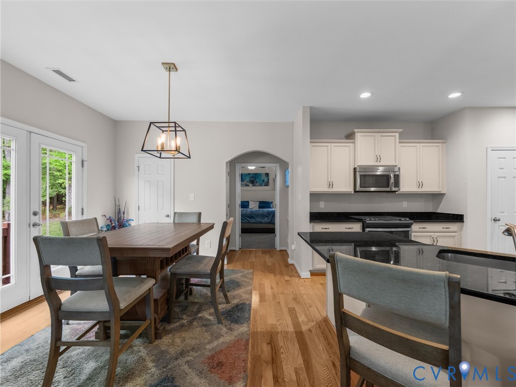 10824 Avening Road Chesterfield, VA 23832 - Photo 16 of 47 a view of a dining room with furniture and chandelier