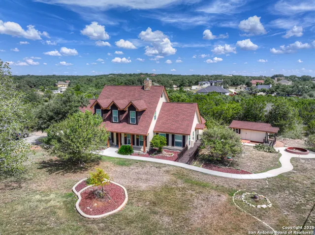 a view of a swimming pool with a yard