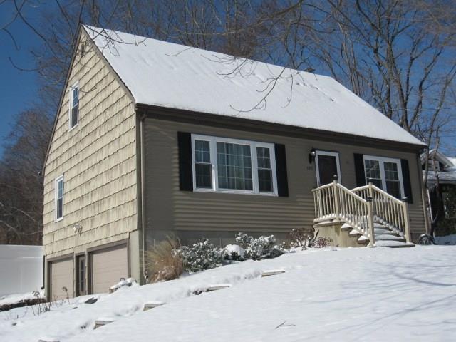 105 Daniels Farm Road Trumbull, CT 06611 - Photo 1 of 1 a front view of a house with a yard covered with snow