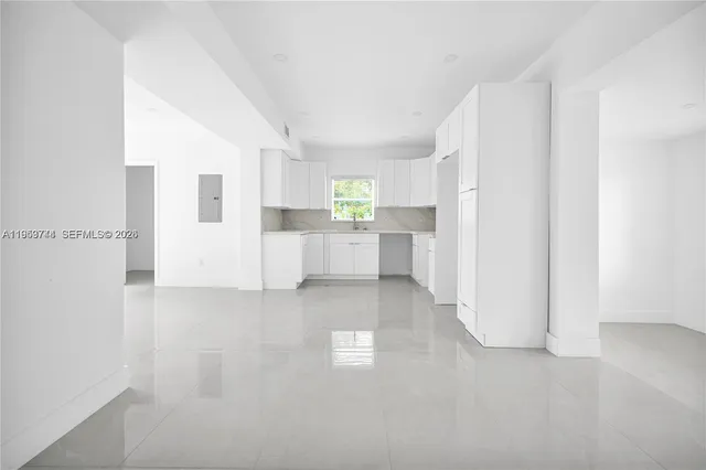a view of a kitchen with a sink cabinets and a window