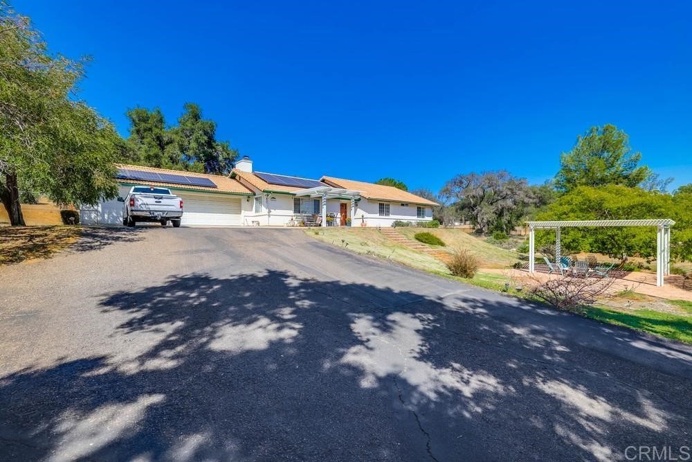16651 Airmail Lane Ramona, CA 92065 - Photo 3 of 36 a view of a house with a yard