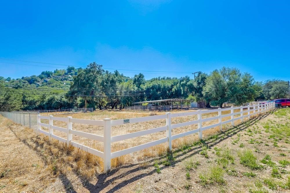 16651 Airmail Lane Ramona, CA 92065 - Photo 31 of 36 a view of a swimming pool with an outdoor seating and a mountain view