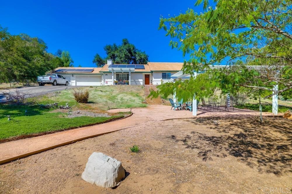 16651 Airmail Lane Ramona, CA 92065 - Photo 5 of 36 a front view of a house with a yard