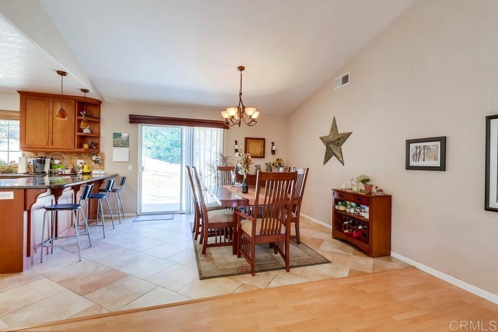 16651 Airmail Lane Ramona, CA 92065 - Photo 10 of 36 a view of a dining room with furniture and chandelier