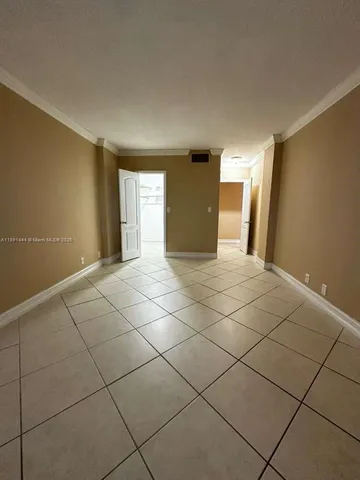 a view of a livingroom with a dishwasher and a refrigerator