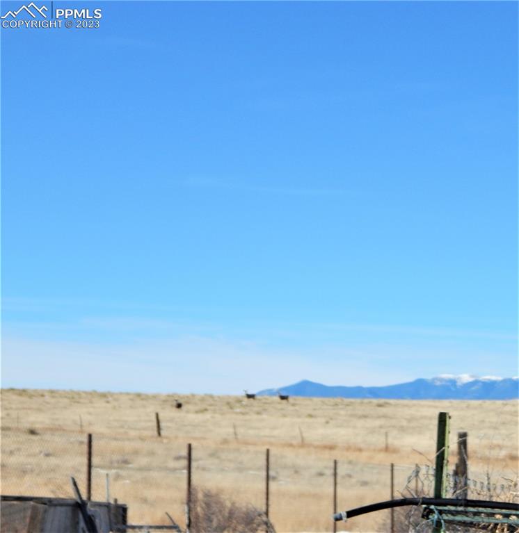 3220 Hoofprint Road Peyton, CO 80831 - Photo 19 of 22 a view of ocean with a large mountain