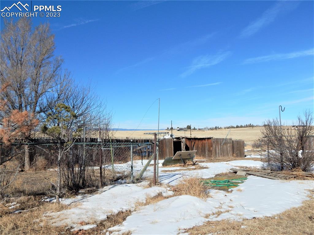 3220 Hoofprint Road Peyton, CO 80831 - Photo 22 of 22 a view of a house with a yard