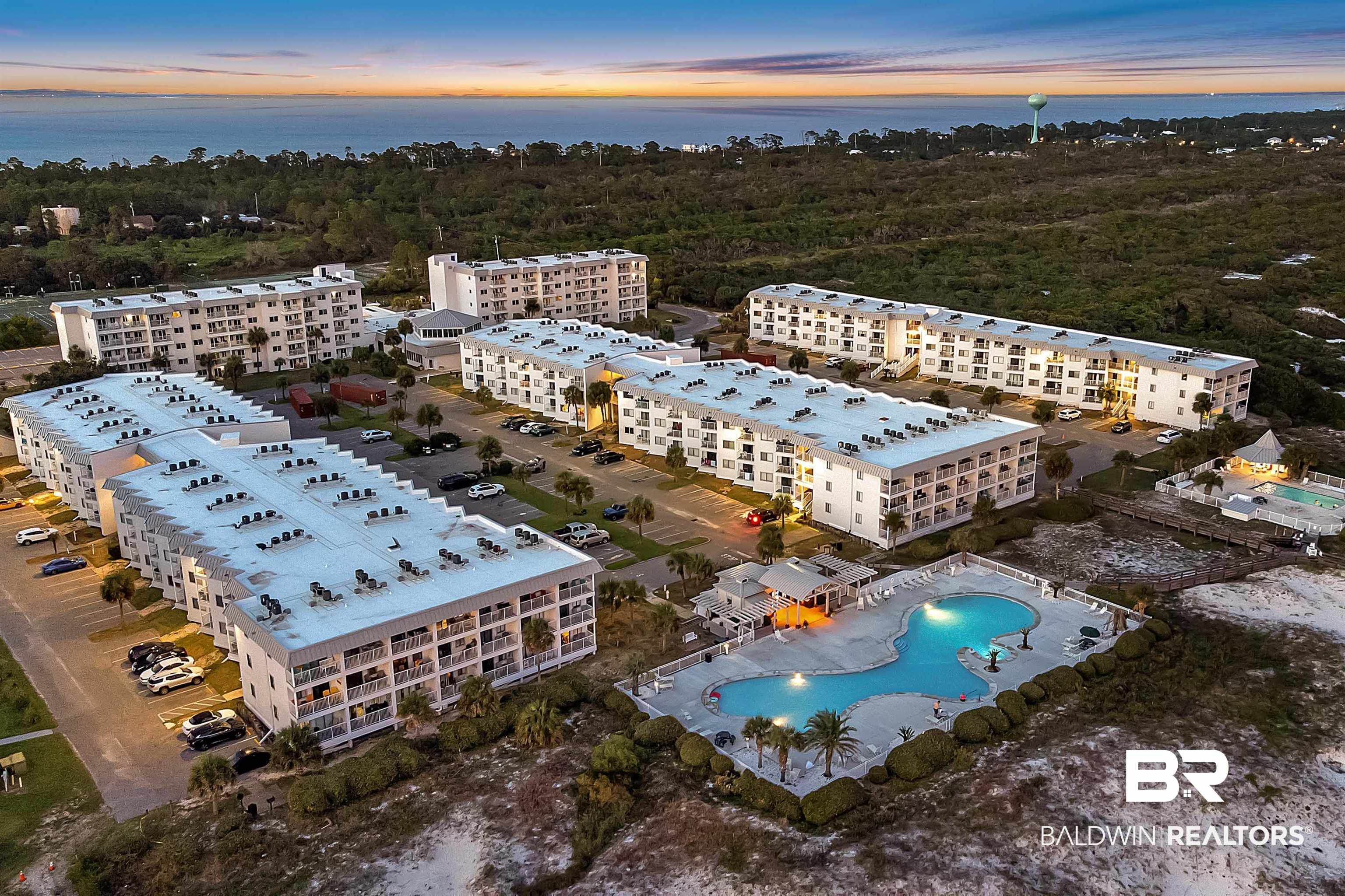 400 Plantation Road, Unit 4112 Gulf Shores, AL 36542 - Photo 44 of 55 Aerial view at dusk featuring a water view