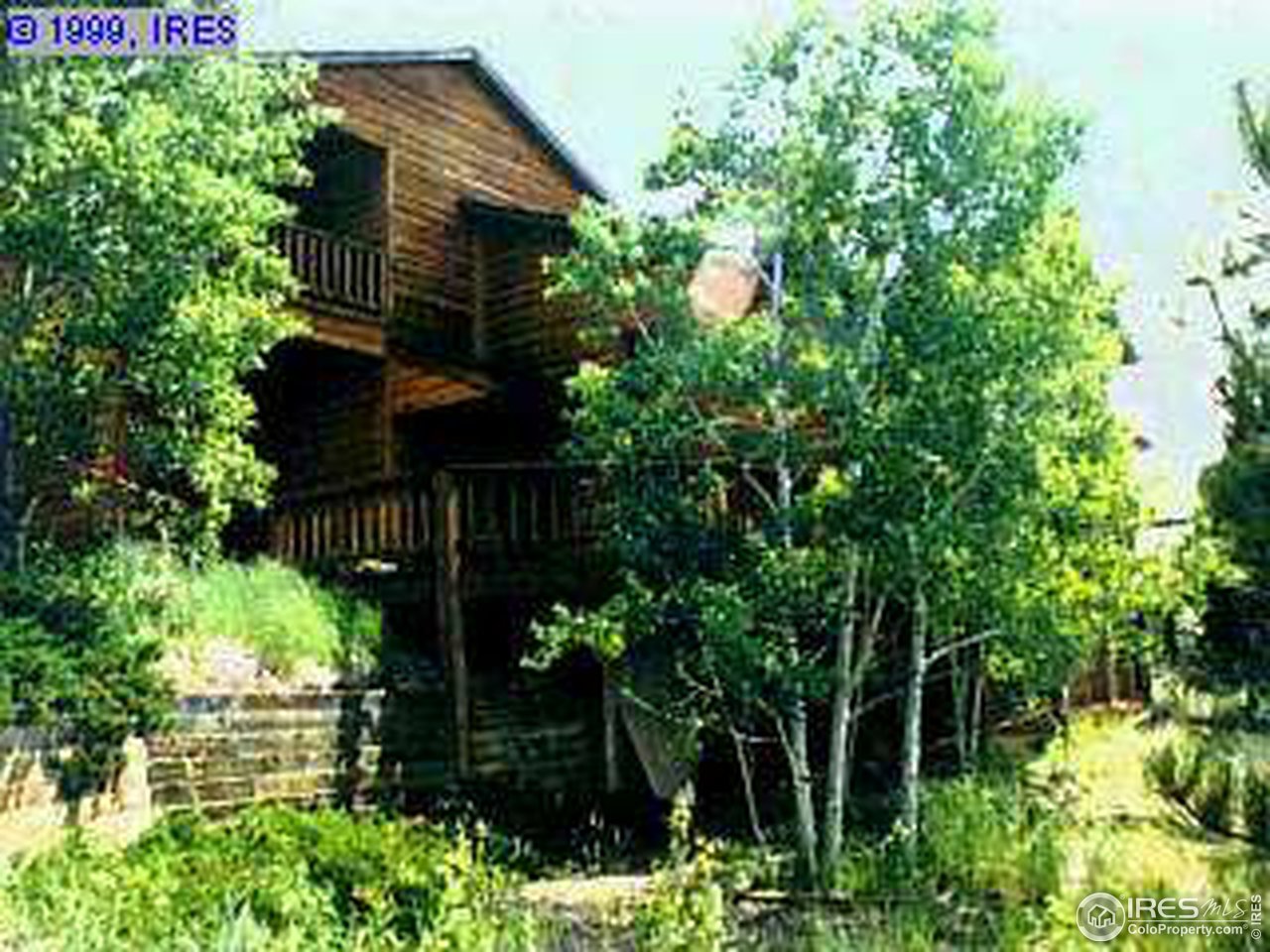47 South Peak Road Boulder, CO 80302 - Photo 2 of 4 a backyard of a house with lots of green space