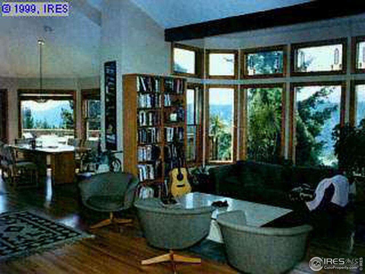 47 South Peak Road Boulder, CO 80302 - Photo 4 of 4 a living room with furniture and a floor to ceiling window