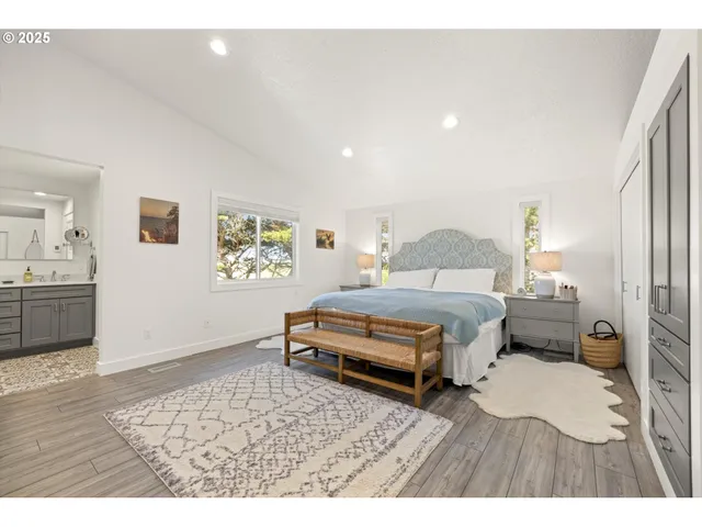 a bedroom with a bed and a view of bathroom