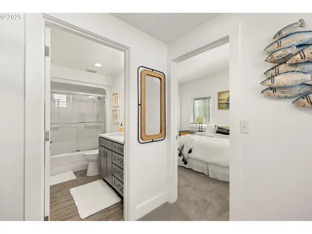 a bathroom with a toilet a sink and a mirror