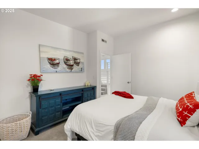 a bedroom with a bed and a dresser