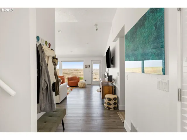 a view of living room with furniture and a large window