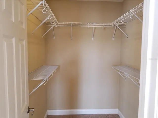 a view of an empty walk in closet