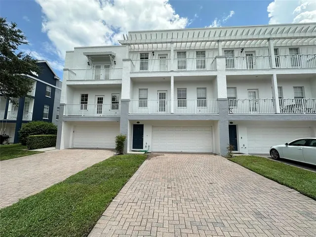 a front view of a building with a yard