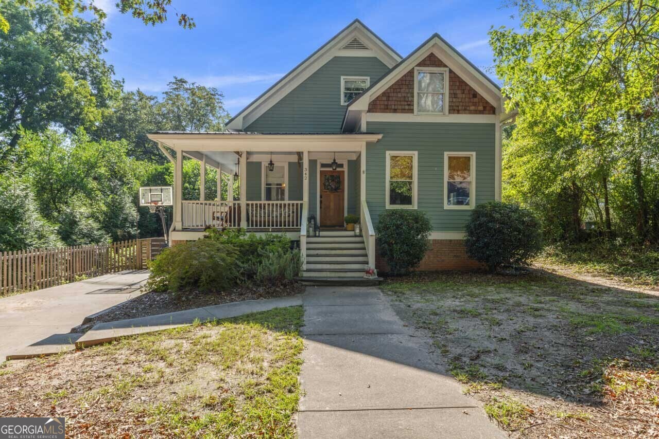 342 Plum Street Madison, GA 30650 - Photo 1 of 1 a front view of a house with garden