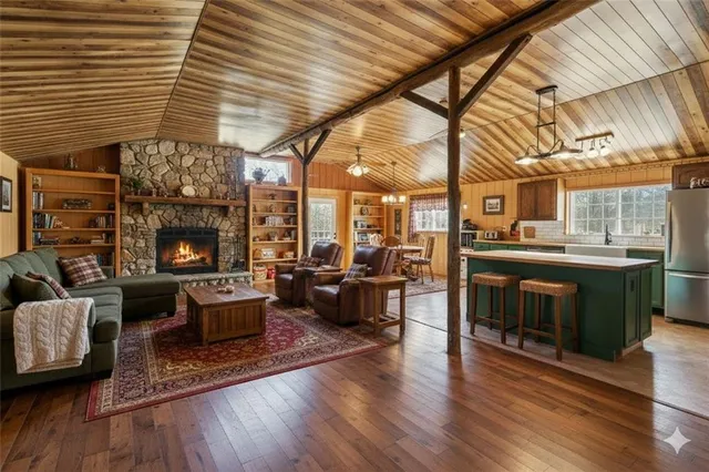 a living room with furniture and fireplace